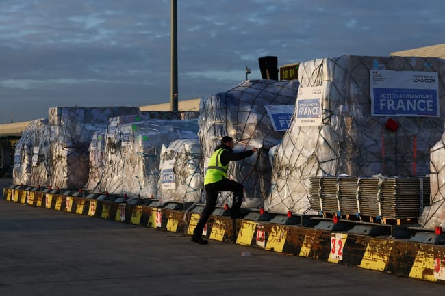 Worldwide Flight Services personnel prepare humanitarian aid packages for the first French humanitarian flight to Beirut, carrying 60 tons of relief supplies and pharmaceutical products, at Paris‑Charles de Gaulle Airport, in Roissy‑en‑France near Paris, France, on March 12, 2026.