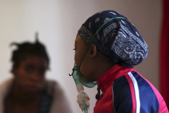 HIV patients chat at Nkosi's Haven, in south of Johannesburg, South Africa, on November 28, 2014.