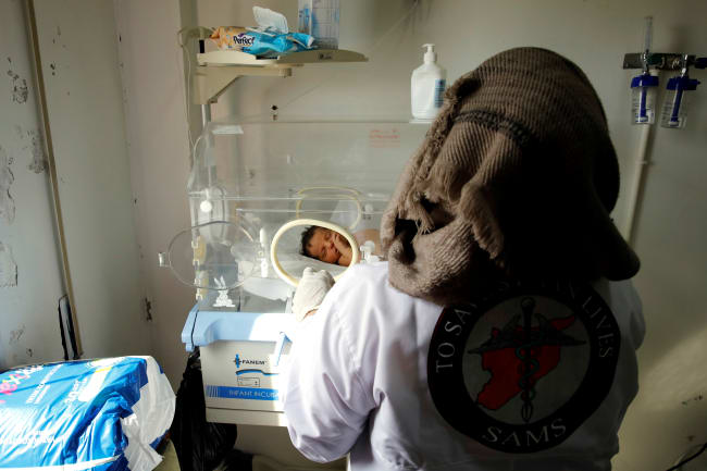 A nurse checks a premature baby at a maternity hospital, in Idlib, Syria, on February 27, 2020.