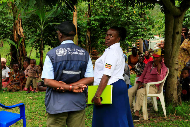 World Health Organization officials and Ugandan health workers inform the community of Kirembo village about the ebola vaccine, in Kasese district, Uganda, on June 15, 2019.