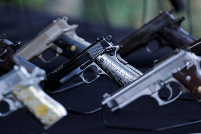 Guns that will be destroyed are displayed during an event for the International Day for the Destruction of Firearms, at the Basilica of Our Lady of Guadalupe, in Mexico City, Mexico, on July 9, 2025.