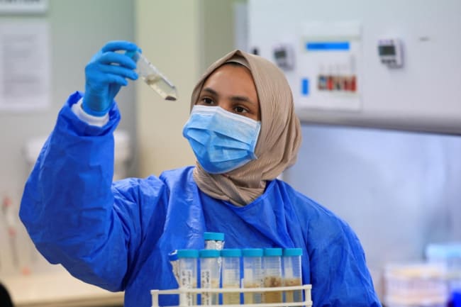 A scientific officer works in the research lab at the University of Cape Town's Institute of Infectious Disease and Molecular Medicine, in Cape Town, South Africa, on February 17, 2025.