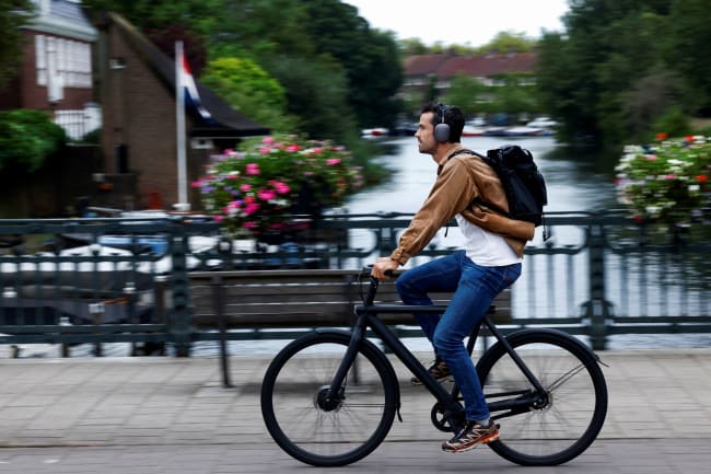 A man rides a VanMoof brand e-bike in Amsterdam, Netherlands, on August 17, 2023.
