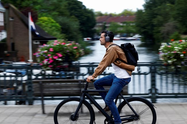A man rides a VanMoof brand e-bike in Amsterdam, Netherlands, on August 17, 2023.