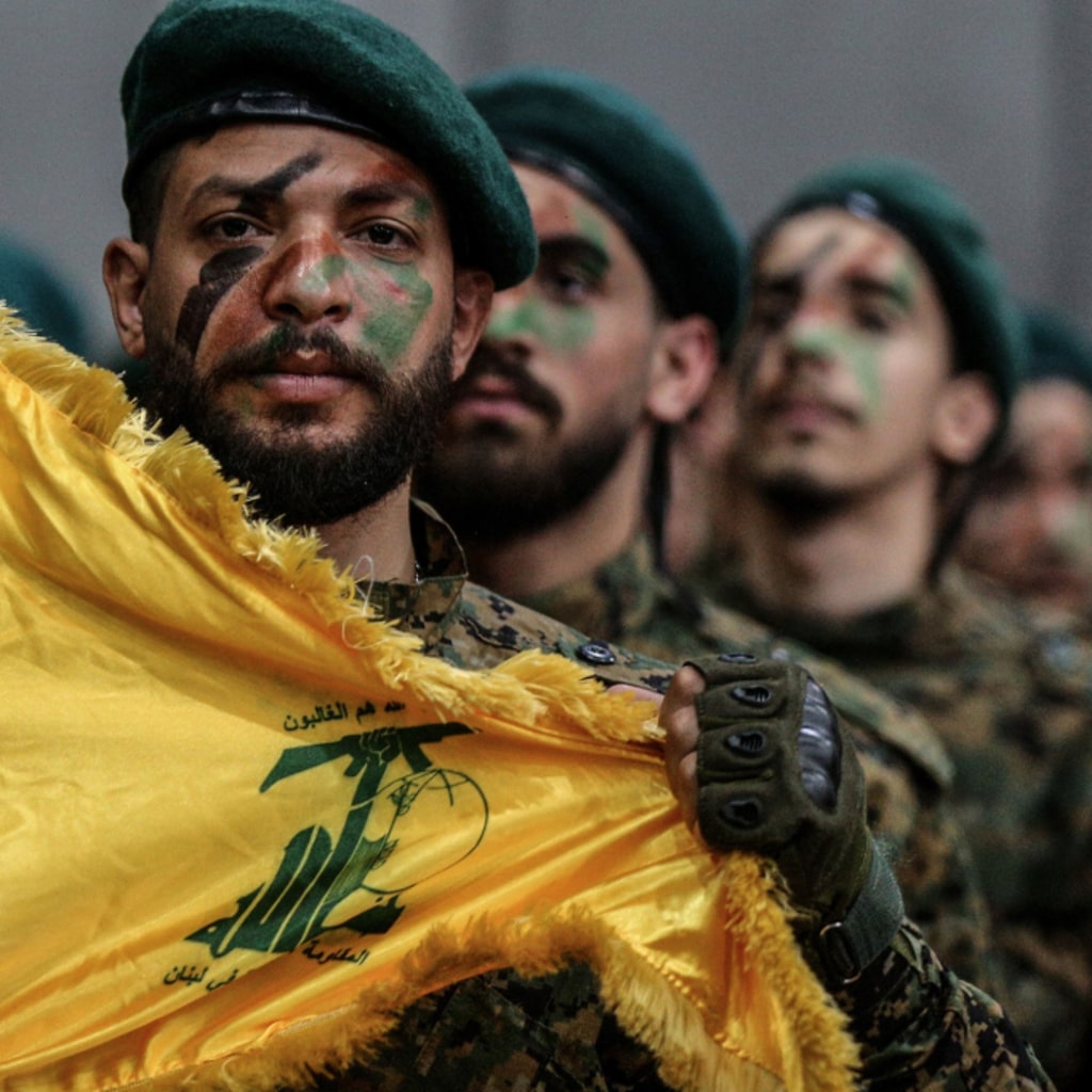 <p> Hezbollah militants parade through Beirut’s southern suburb.</p>