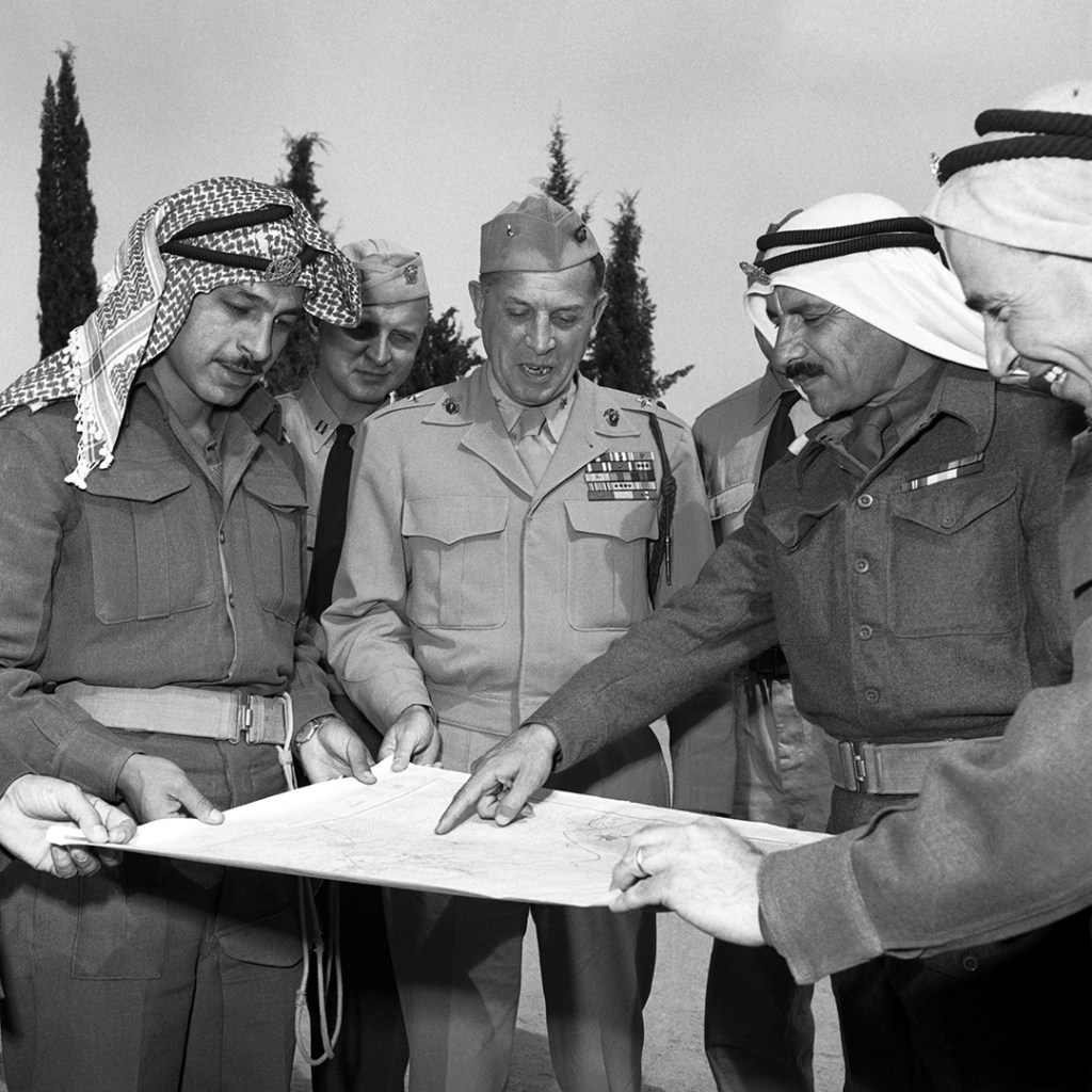 General William E. Riley, chief of staff of the Mediator’s Truce Supervision Headquarters, speaks with Arab Legion officers and UN observers at UNTSO headquarters in East Jerusalem, 1948. LM/UN Photo