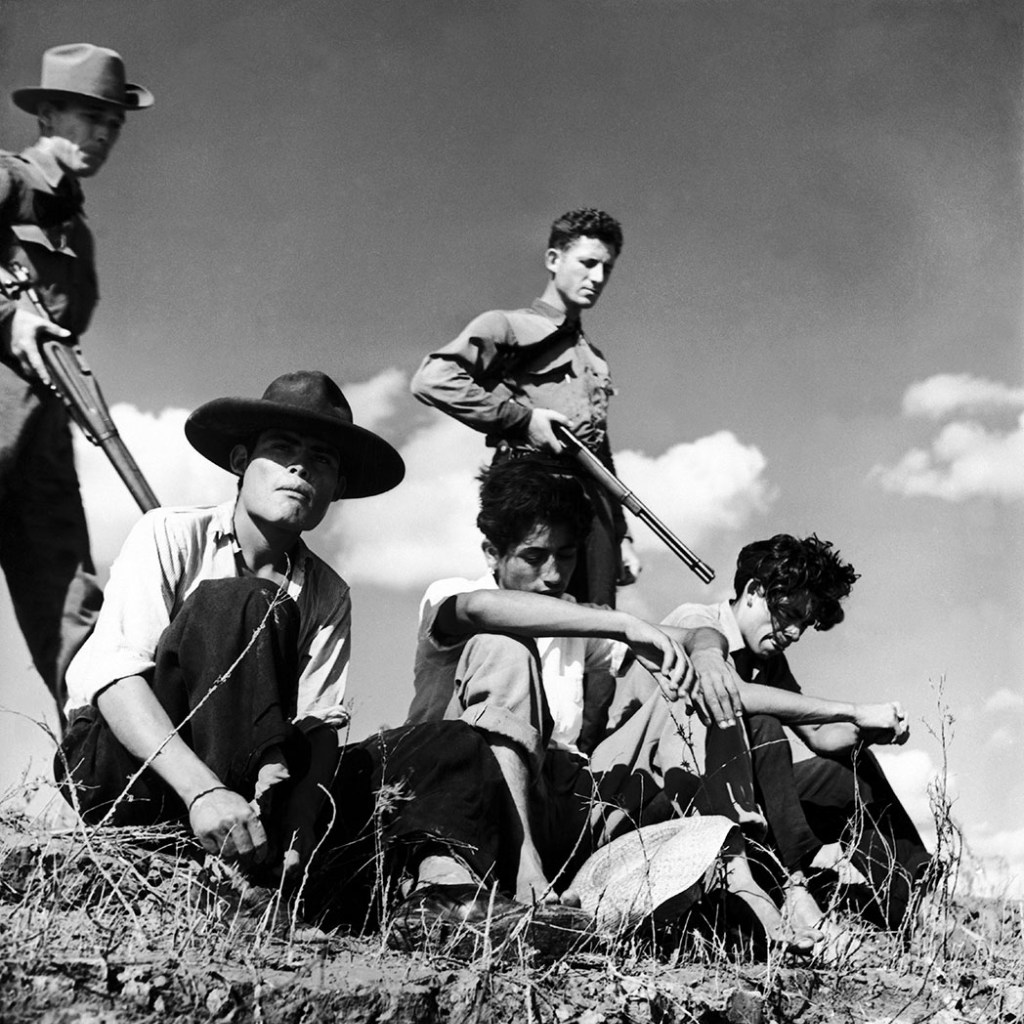 Three undocumented Mexican immigrants held under arrest. Gamma Keystone/Getty