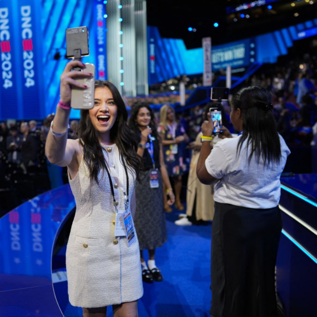 <p>An influencer takes a selfie at the Democratic National Convention.</p>
