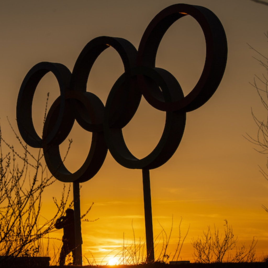 <p>LONDON, UNITED KINGDOM- MARCH 23: People pose for pictures in front of the Olympic rings in the Olympic Park in Stratford as Tokyo Olympics organisers are considering options to delay the Olympics with teams treating to pull out due to the coronavirus on </p>
