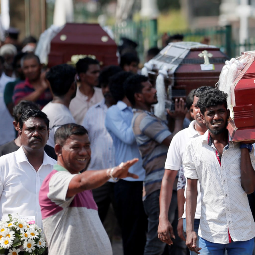 <p>Coffins of victims are carried in Colombo, Sri Lanka.</p>
