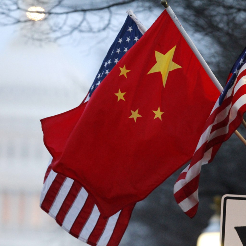 The People's Republic of China flag and the U.S. Stars and Stripes fly along Pennsylvania Avenue near the U.S. Capitol in Washington