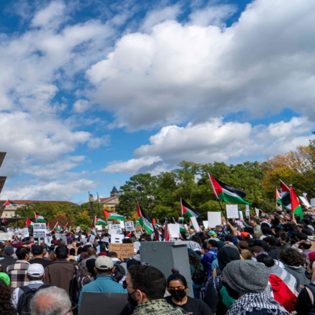 <p>People gather for a rally held by American Muslims for Palestine calling for a cease fire in Gaza near the Washington Monument in Washington, U.S., October 21, 2023.</p>