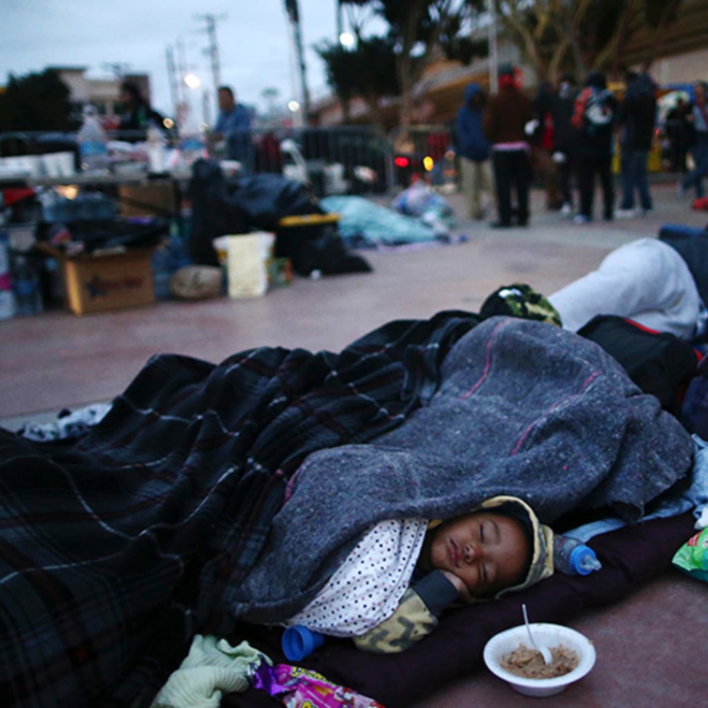 Members of a caravan of migrants from Central America sleep near the San Ysidro checkpoint