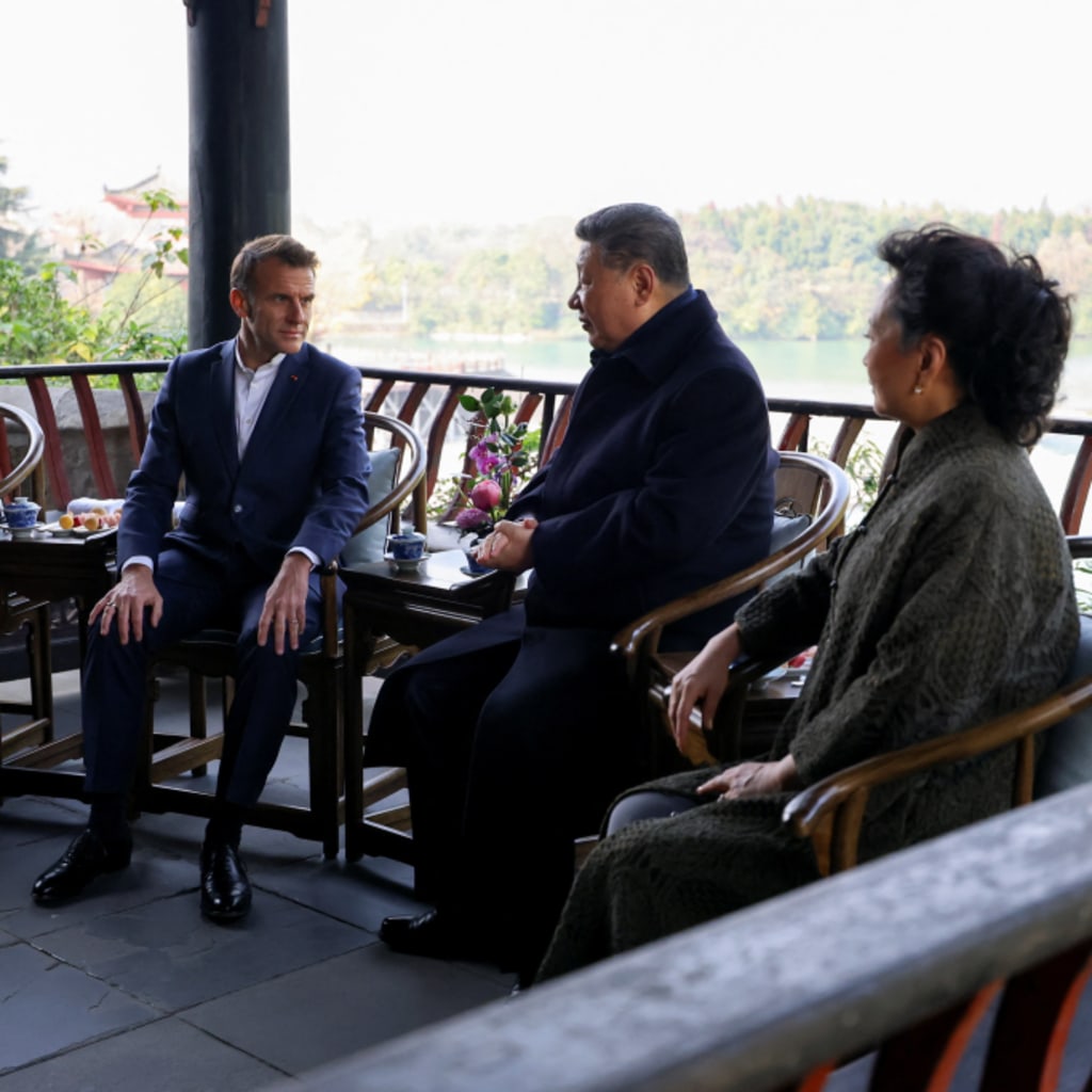 French President Emmanuel Macron, his wife Brigitte Macron, Chinese President Xi Jinping and his wife Peng Liyuan visit the Dujiangyan site, designated a UNESCO World Heritage Site, in Dujiangyan, Sichuan province, as part of a three-day visit to China, December 5, 2025. REUTERS/Sarah Meyssonnier/Pool