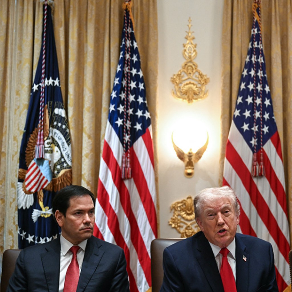 US President Donald Trump speaks alongside Secretary of State Marco Rubio (L) and Defense Secretary Pete Hegseth (R) during a cabinet meeting in the Cabinet Room of the White House in Washington, DC, on January 29, 2026.