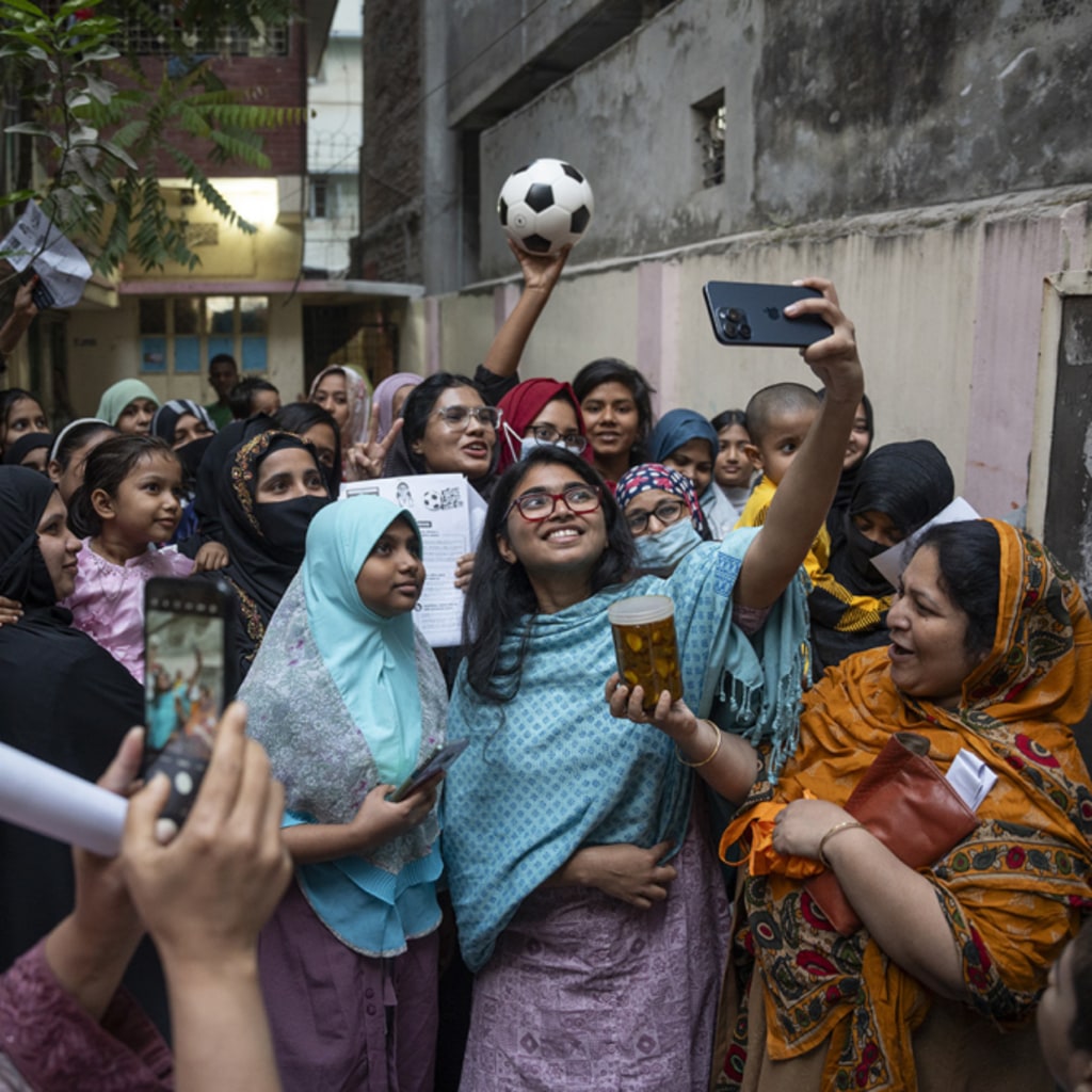 Image of Bengali women taking a selfie.