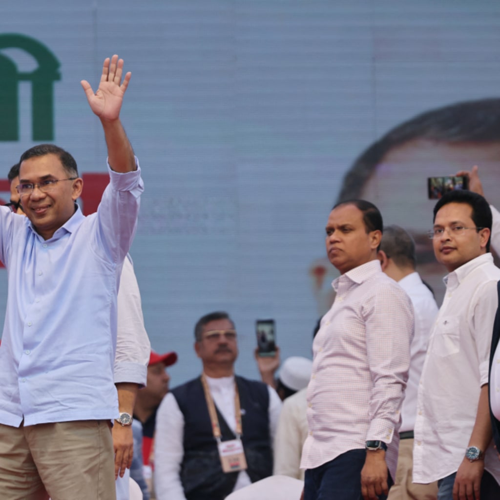 Bangladesh Nationalist Party chairman Tarique Rahman gestures to crowd during an election campaign rally.