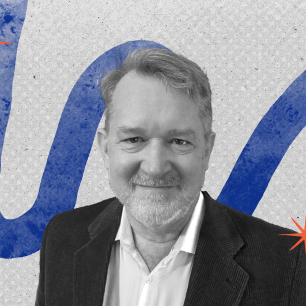 Alan Cullison featured in front of a blue graphic design background.