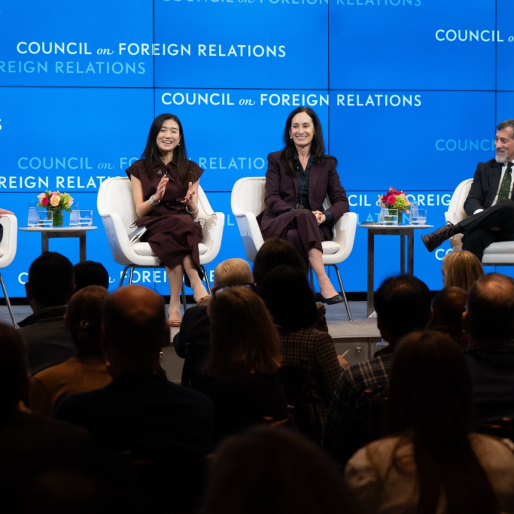 Speakers on stage for discussion