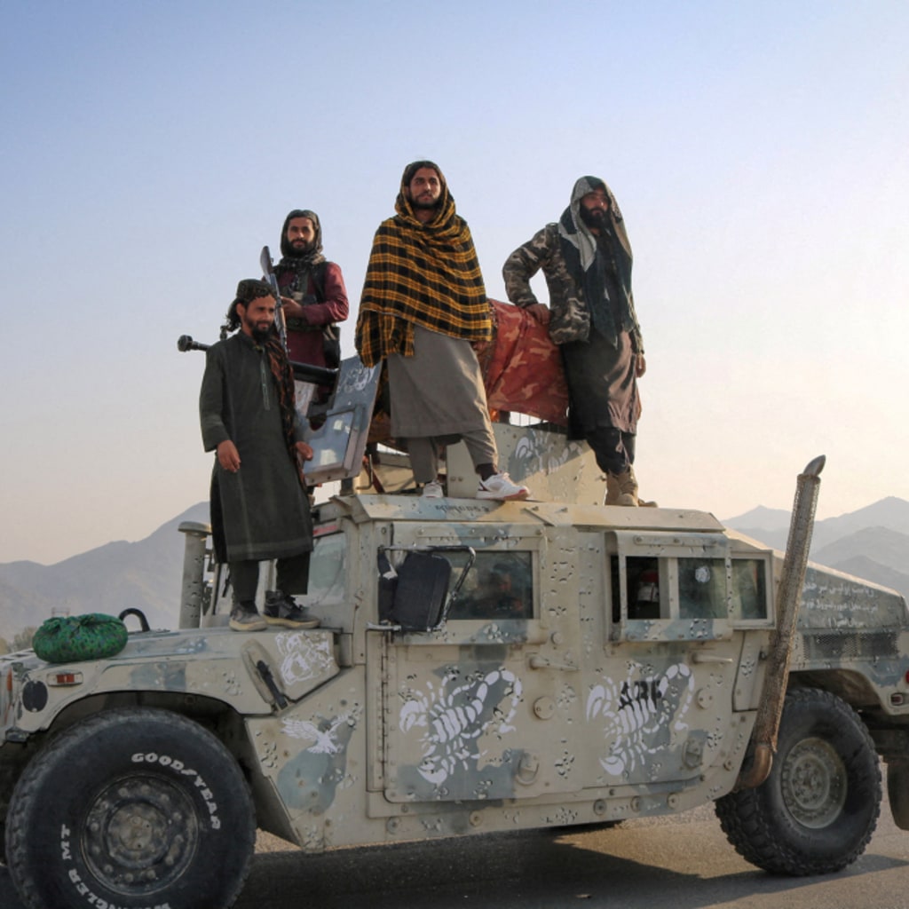 Taliban soldiers pose as they stand on a Humvee, following exchanges of fire between Pakistani and Afghan forces, in Momand Dara, Nangarhar province, Afghanistan, February 28, 2026.