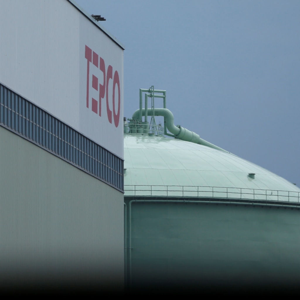 The TEPCO logo and a LNG tank are seen at Tokyo TEPCO's South Yokohama Thermal Power Station in Yokohama