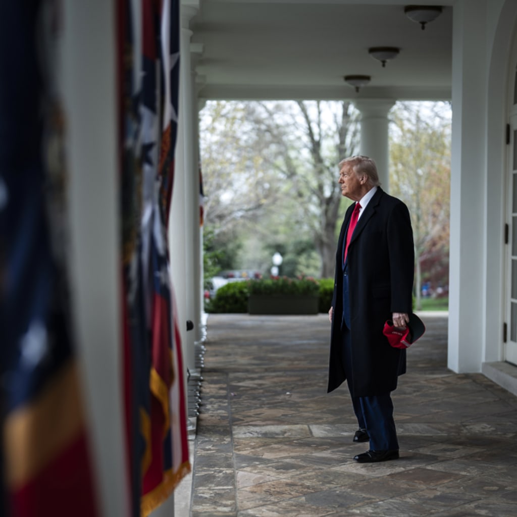 Image of President Trump about to walk onto the Rose Garden.