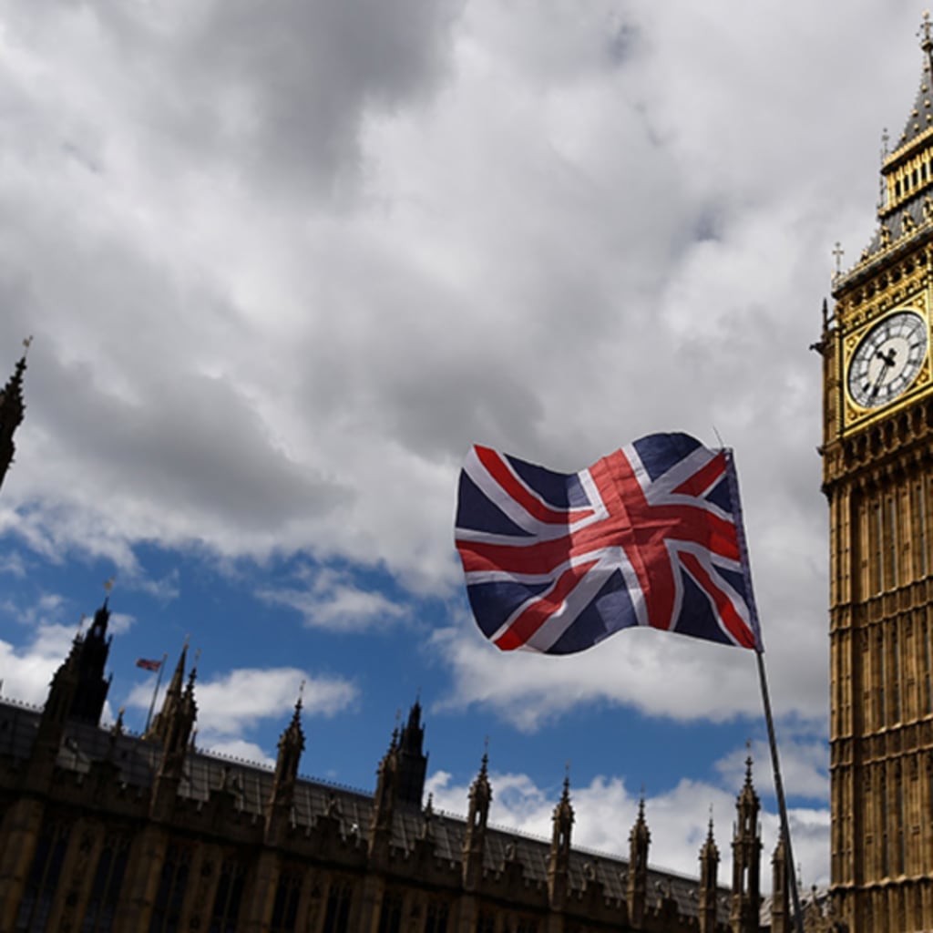 <p>The national flag of the United Kingdom flies near the Houses of Parliament the day before a general election in central London, Britain. </p>