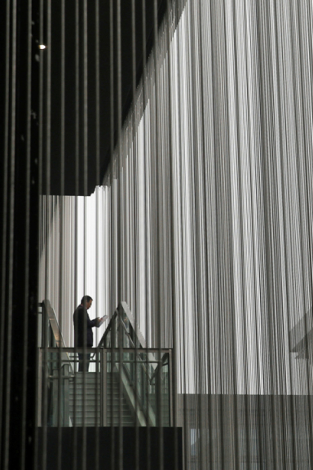 <p>A man looks at a phone during the third annual World Internet Conference in Jiaxing, China, November 2016.</p>