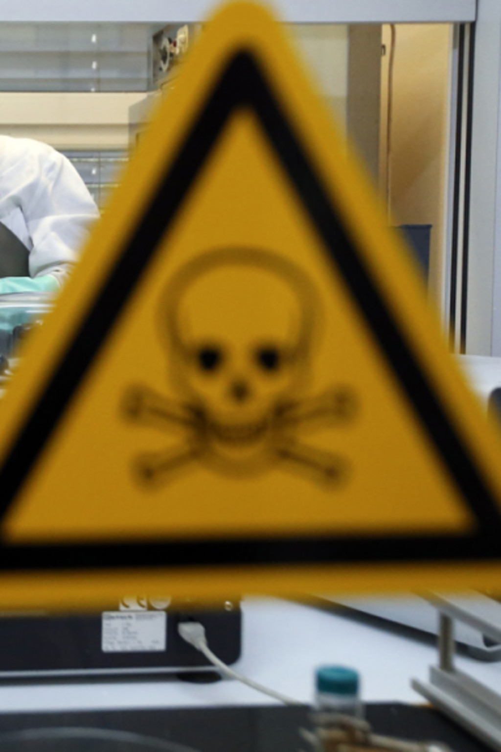 <p>German researchers inspect a dummy sample contaminated with a substance similar to sarin</p>
