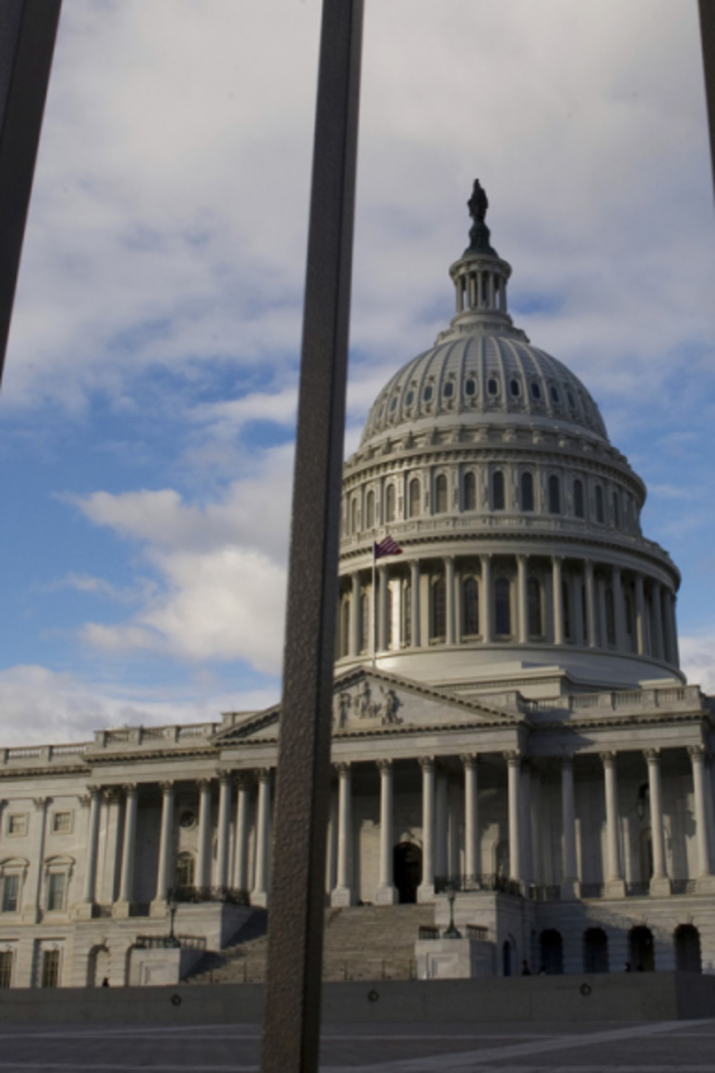 <p>The U.S. Capitol building in Washington, DC, pictured behind a fence.</p>
