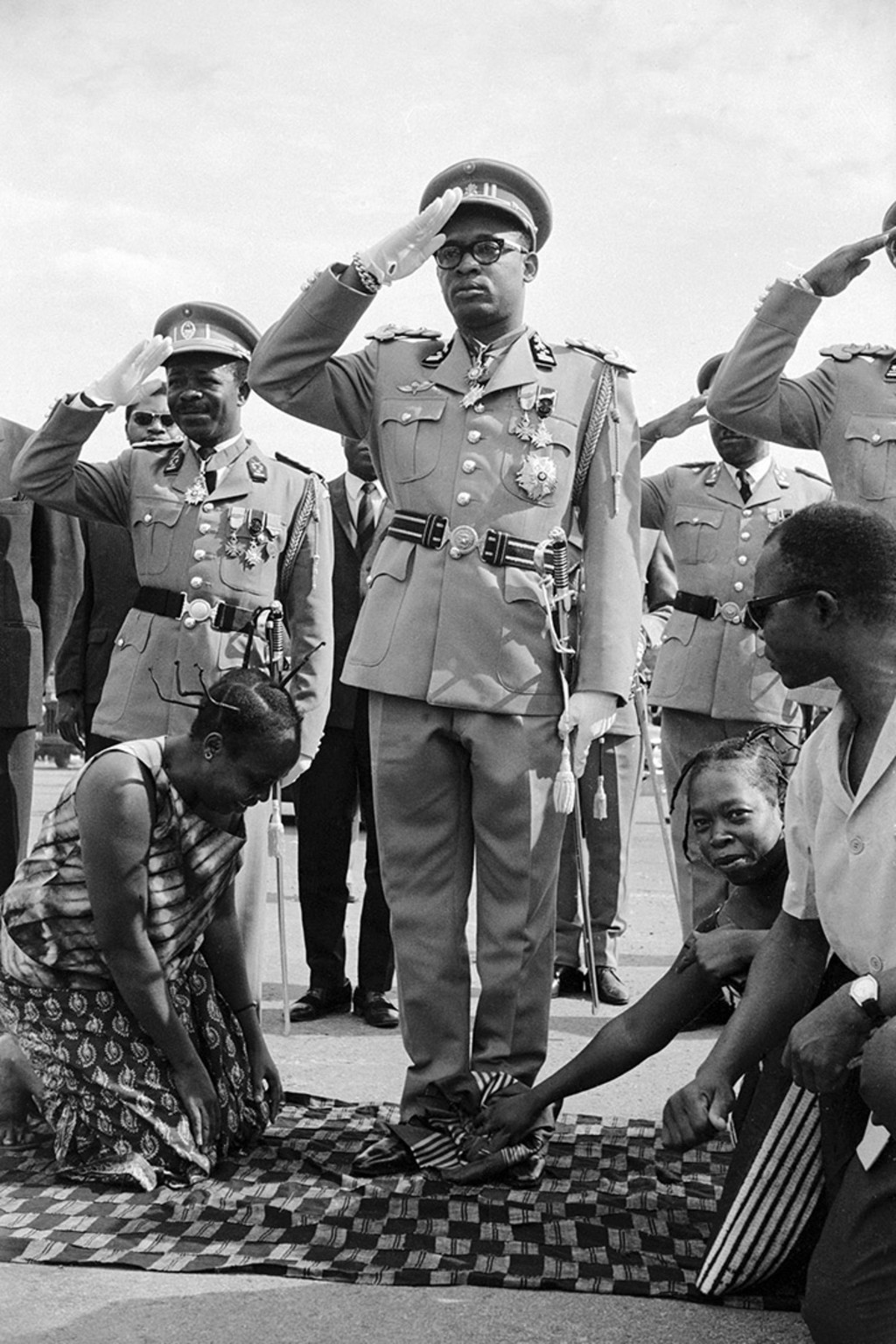 General Joseph-Désiré Mobutu has his shoes polished at the opening ceremonies of Parliament on November 24, 1965, the day of his coup. AP Photo