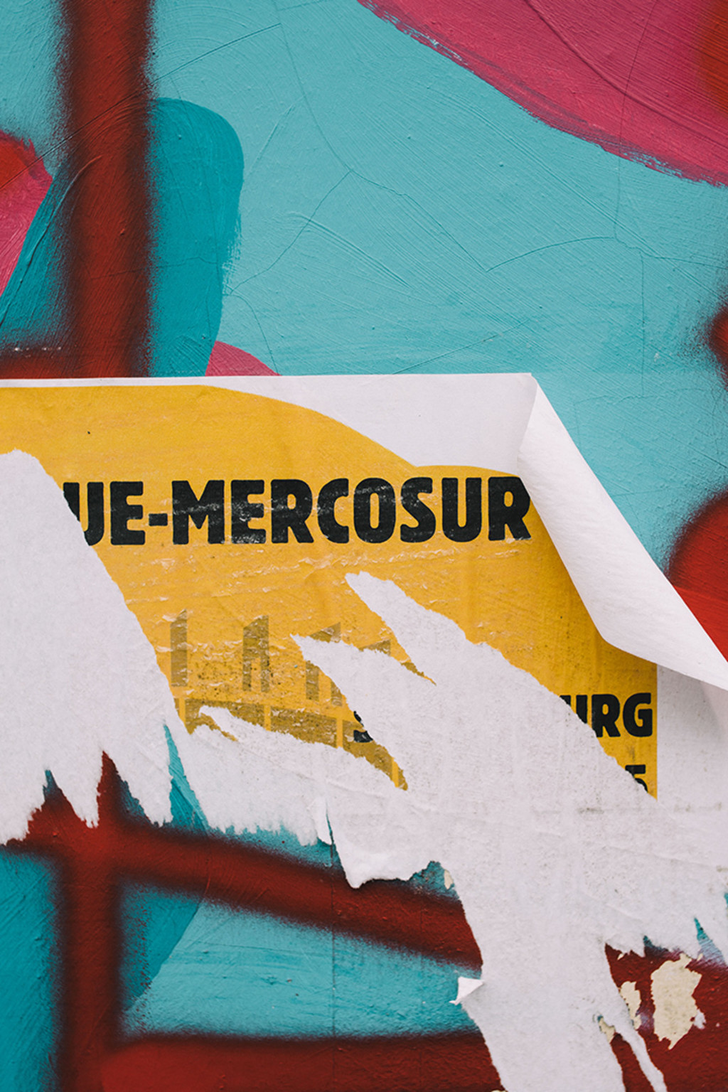 A poster about Mercosur is torn down in a street in Strasbourg, France.
