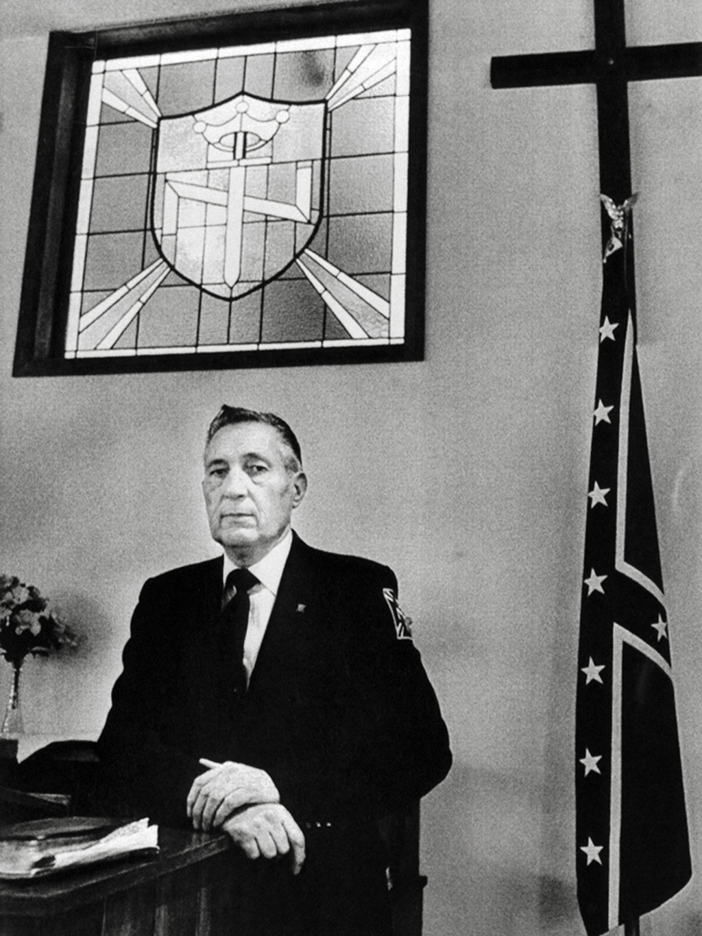 Reverend Richard Butler poses in his church at the headquarters of the Aryan Nations neo-nazi organization, in northern Idaho. 
