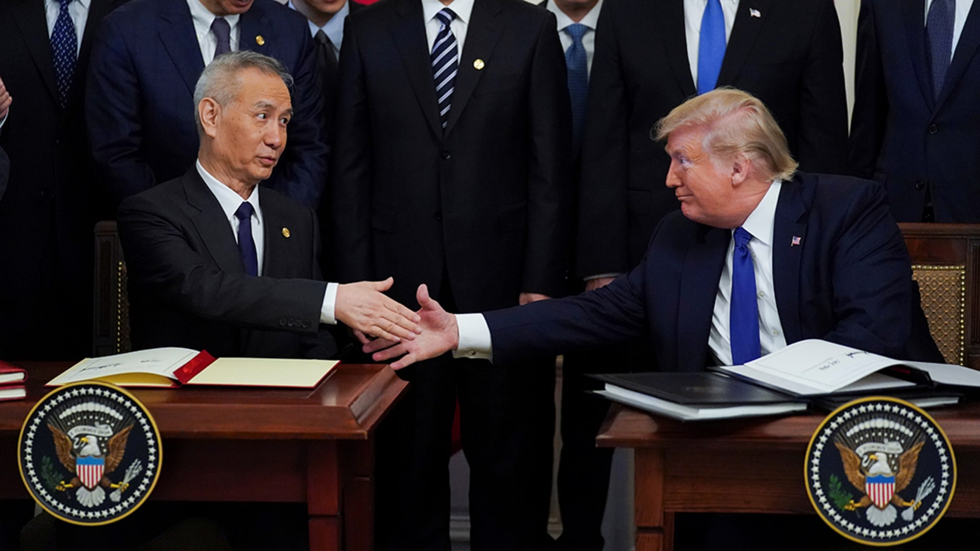 Chinese Vice Premier Liu He and U.S. President Donald Trump shake hands after signing the “phase one” deal.