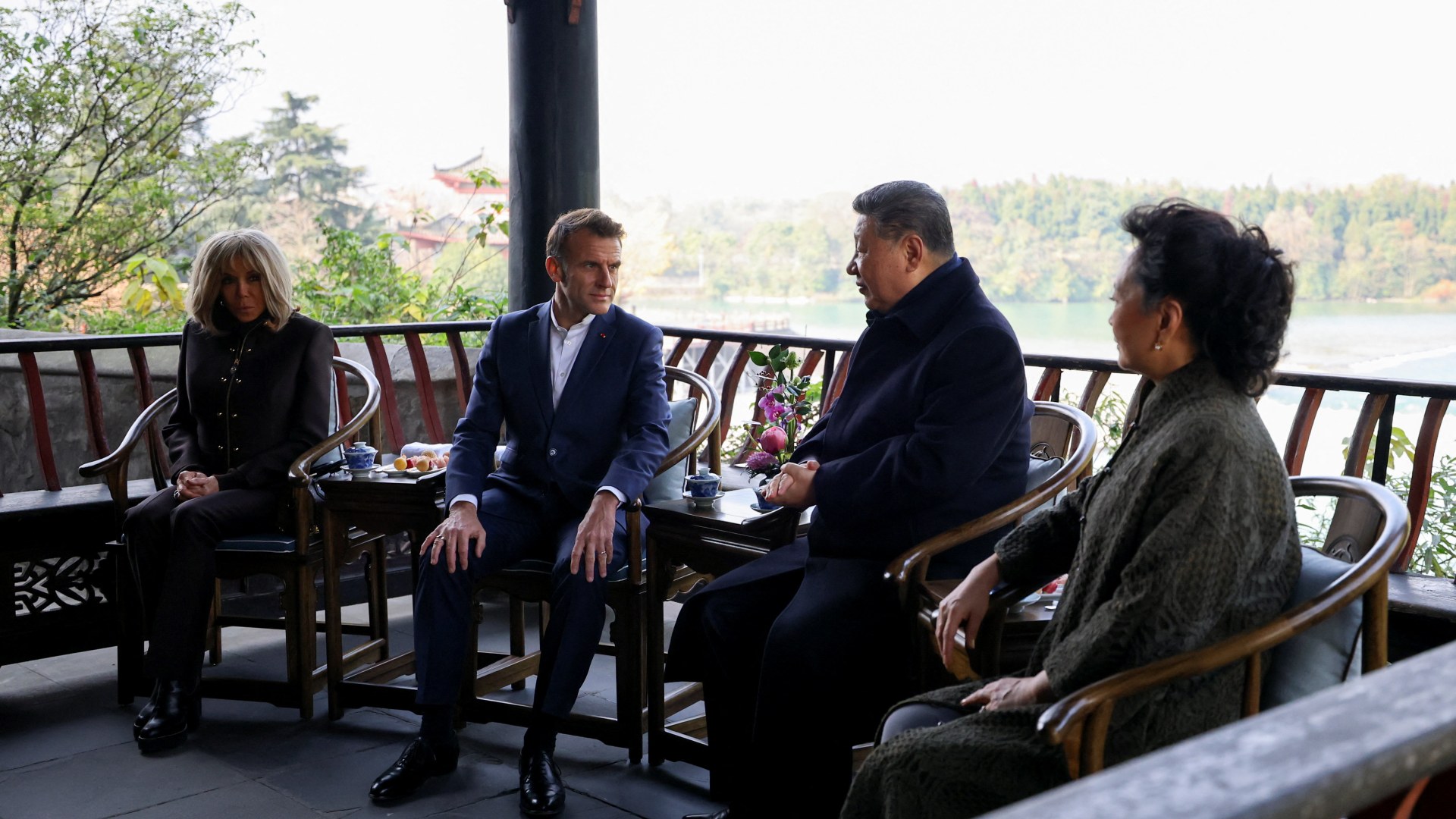 French President Emmanuel Macron, his wife Brigitte Macron, Chinese President Xi Jinping and his wife Peng Liyuan visit the Dujiangyan site, designated a UNESCO World Heritage Site, in Dujiangyan, Sichuan province, as part of a three-day visit to China, December 5, 2025. REUTERS/Sarah Meyssonnier/Pool