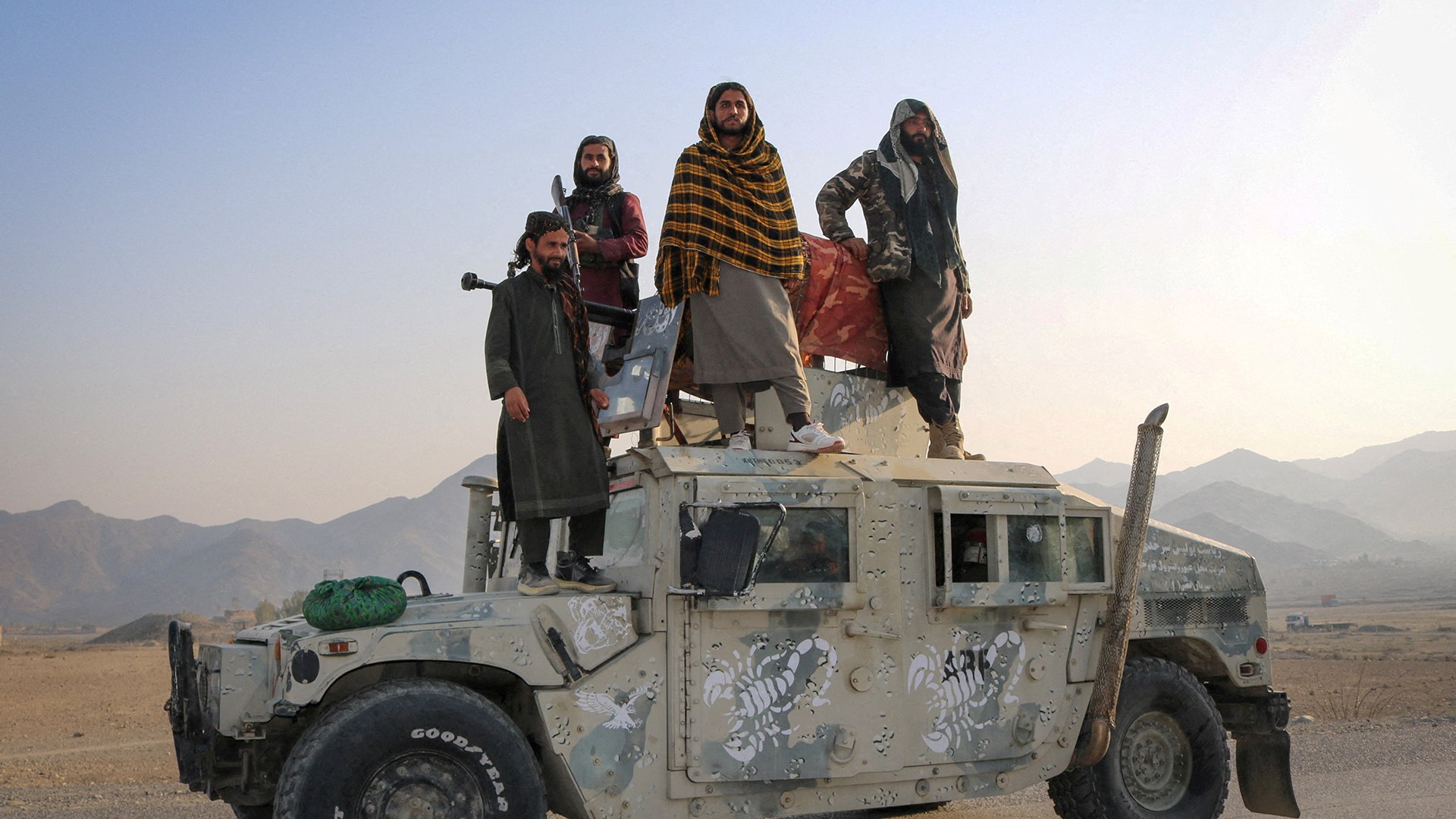 Taliban soldiers pose as they stand on a Humvee, following exchanges of fire between Pakistani and Afghan forces, in Momand Dara, Nangarhar province, Afghanistan, February 28, 2026.