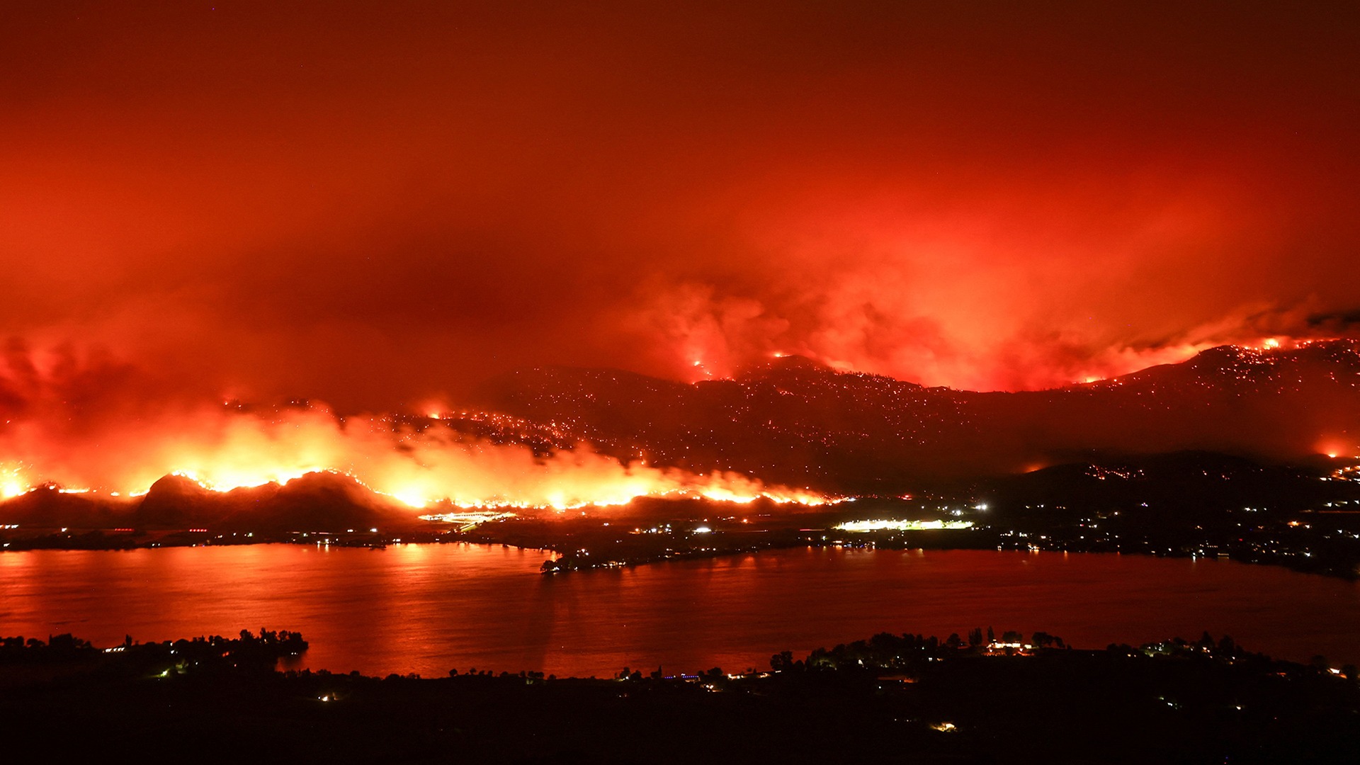 A long exposure image taken by night shows the Eagle Bluffs Wildfire in Canada.