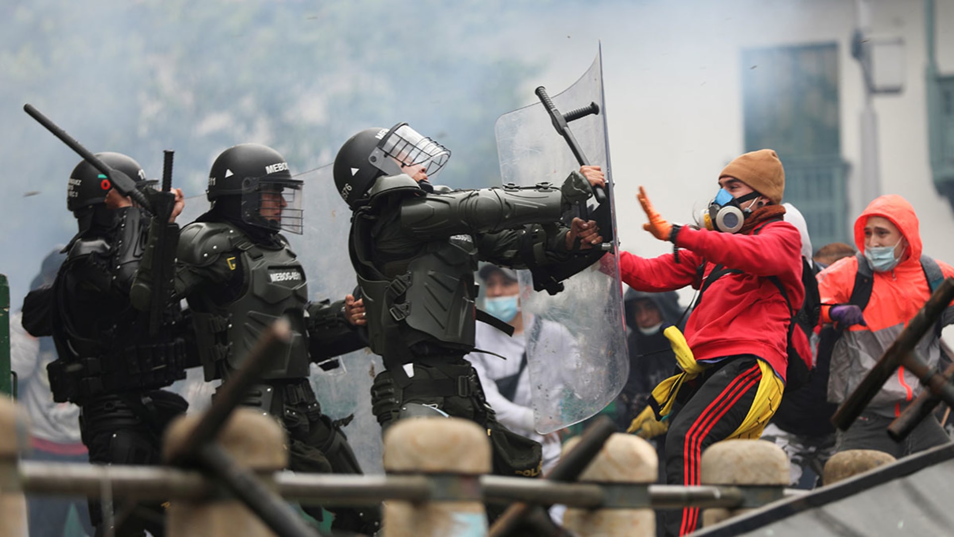 Colombian security forces clash with demonstrators during a protest against proposed tax reforms in Bogota in April 2021. Luisa Gonzalez/Reuters
