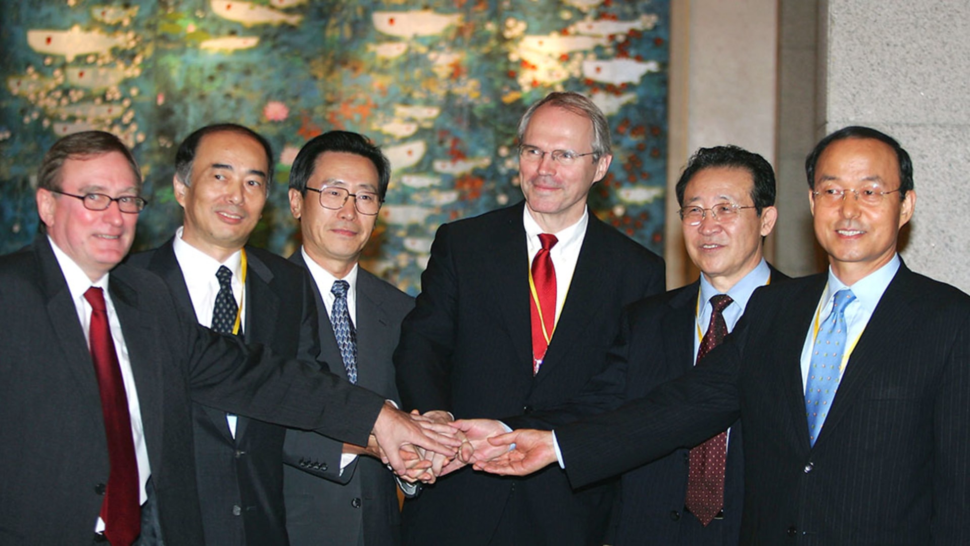 Negotiators in Beijing shake hands after the fourth round of the Six Party Talks. Guang Niu/Getty Images
