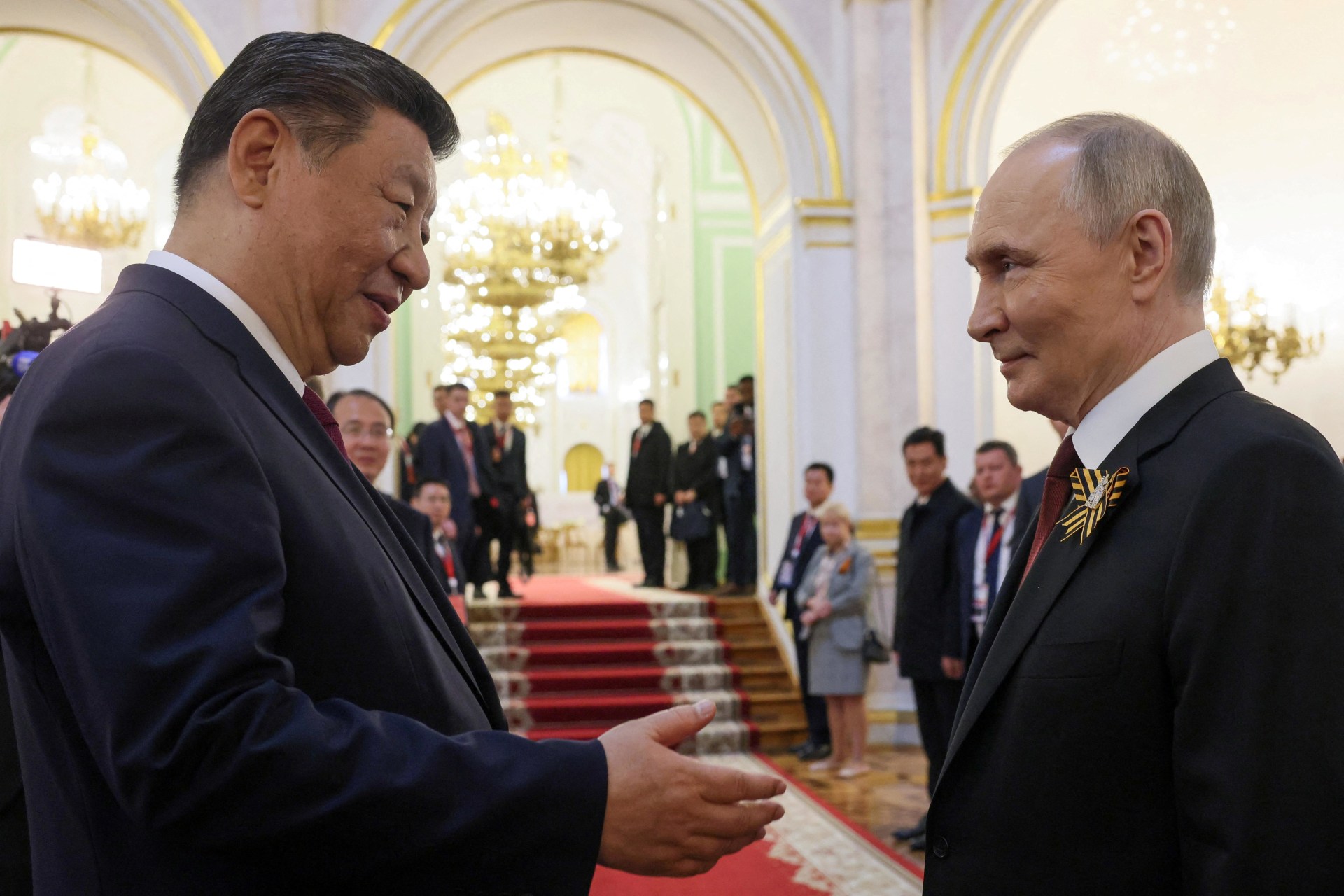 <p>Russian President Vladimir Putin shakes hands with Chinese President Xi Jinping during a reception, held on Victory Day marking the 80th anniversary of the victory over Nazi Germany in World War Two, at the Kremlin in Moscow, Russia, May 9, 2025.</p>