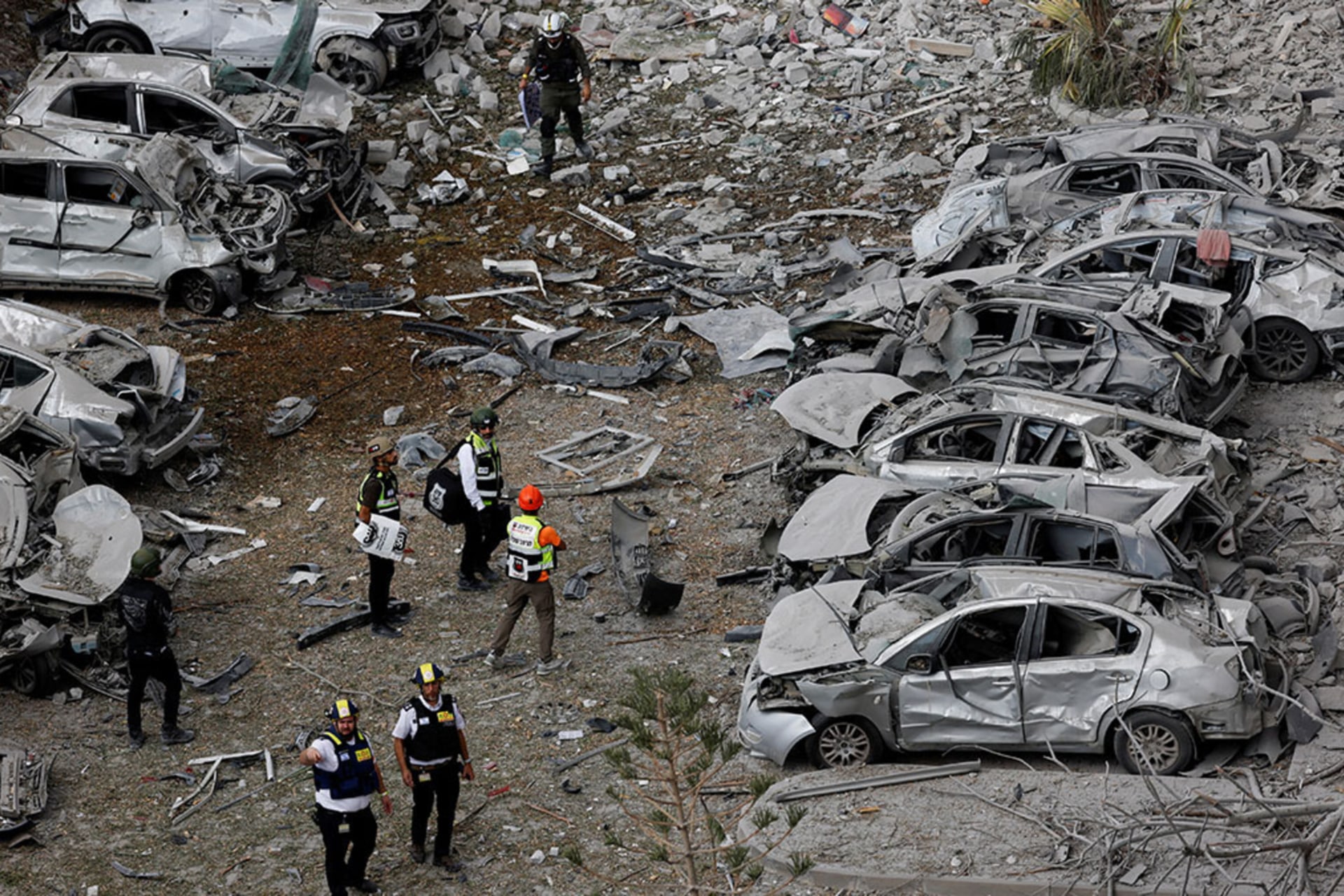 <p>Emergency personnel work amid debris at an impacted residential site in Be’er Sheva, Israel on June 24, 2025.</p>
