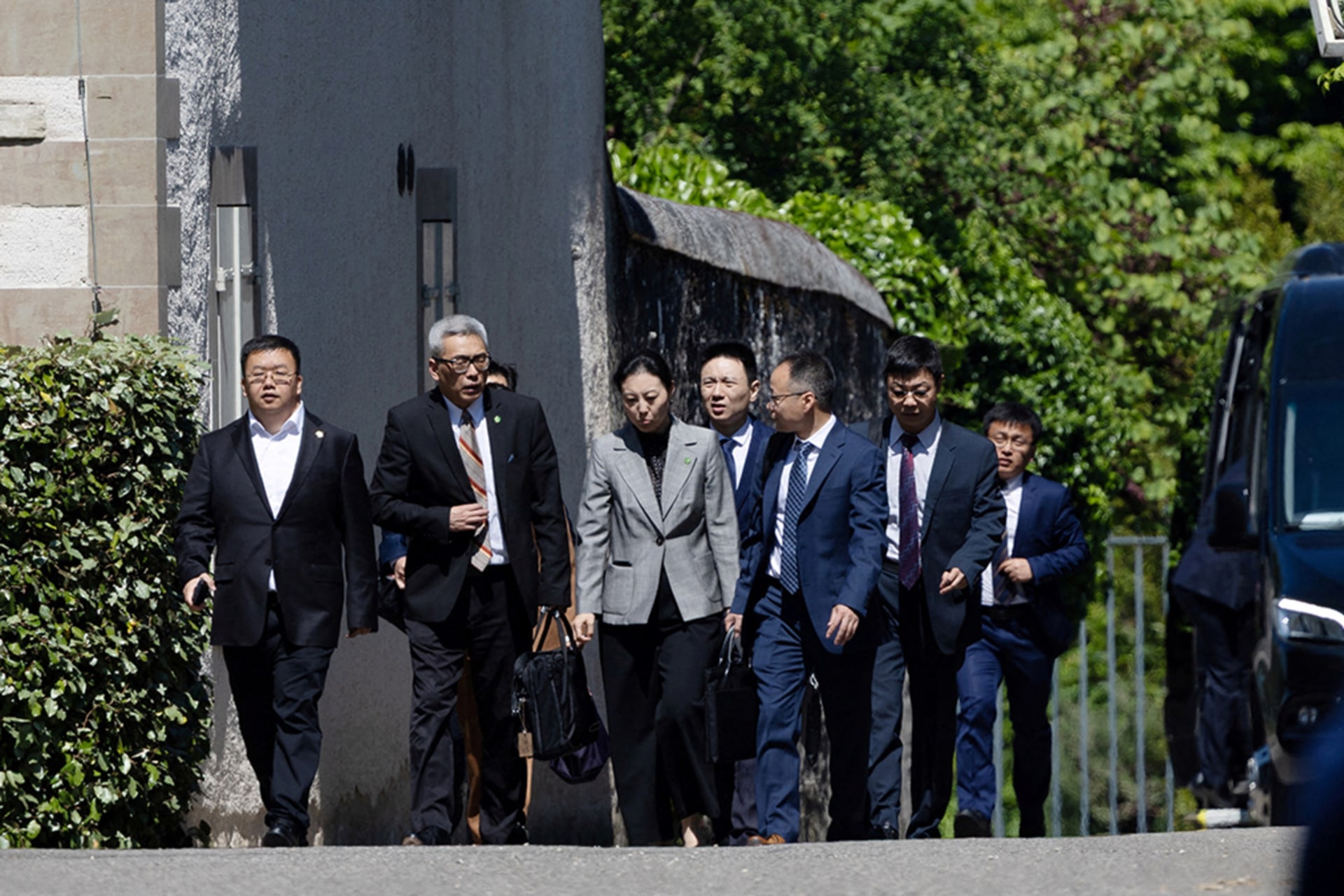 <p>Members of the Chinese delegation leave a residence where trade talks between U.S. and Chinese delegations take place in Geneva.</p>
