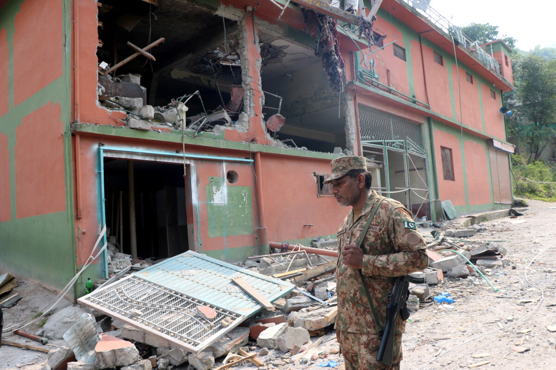 <p>A Pakistani soldier surveys damage Bilal Mosque after it was hit by an Indian strike in Muzaffarabad, the capital of Pakistan-administered Kashmir, May 7, 2025.</p>