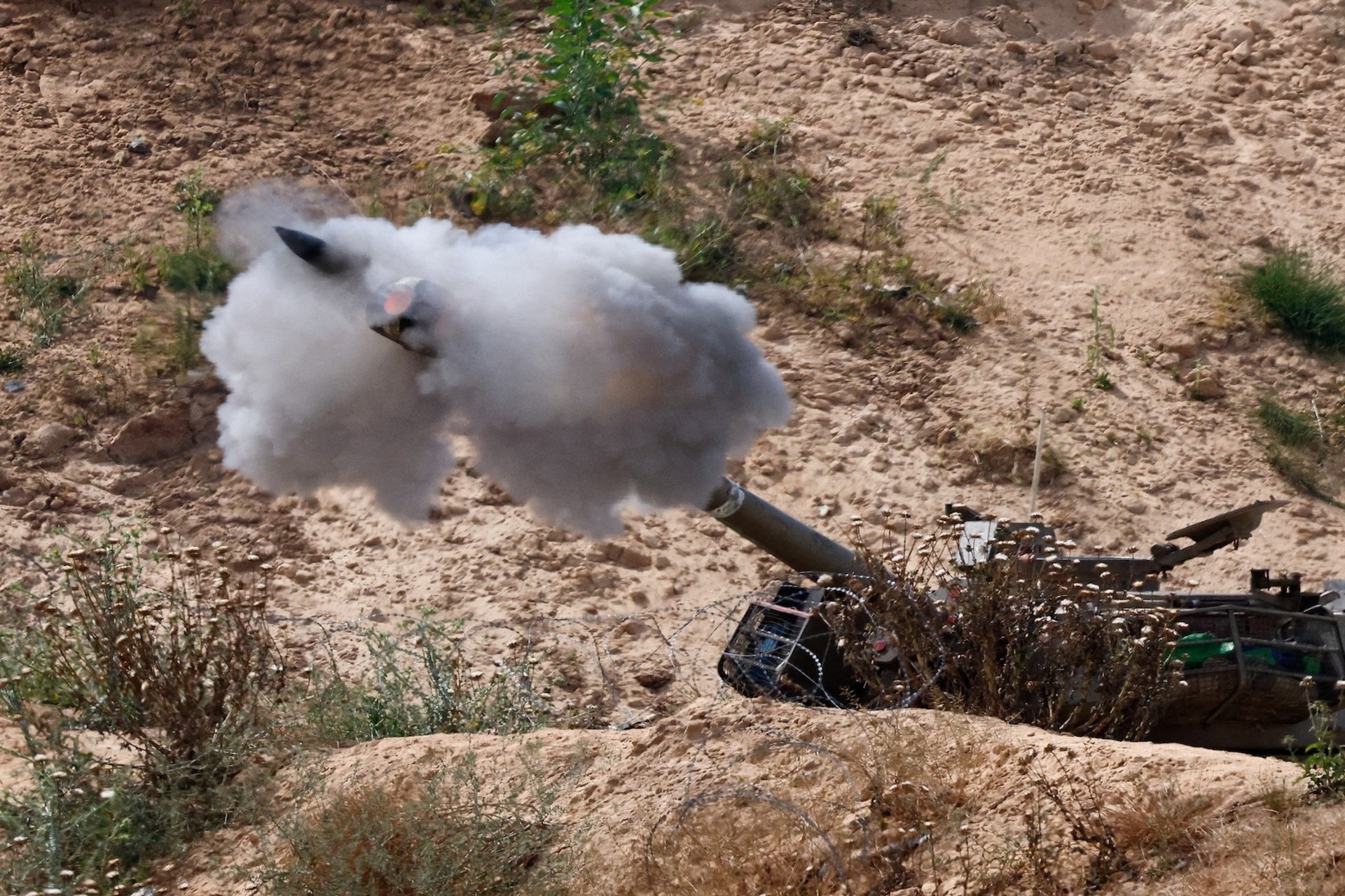 <p>A mobile artillery unit fires towards Gaza, as seen from Israel, May 6, 2025.</p>
