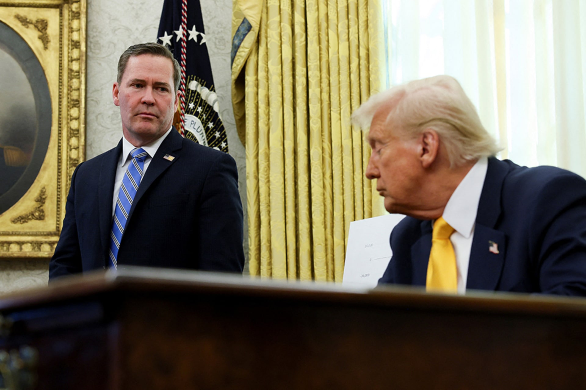 <p>U.S. National Security Advisor Michael Waltz stands next to President Donald Trump in the Oval Office, March 7, 2025.</p>