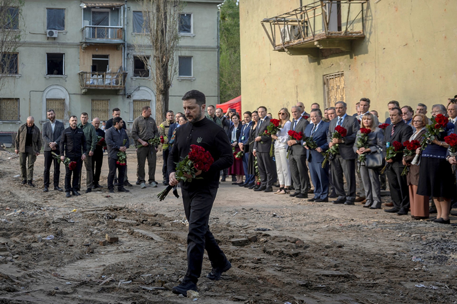 <p>Ukraine’s President Volodymyr Zelenskyy and members of diplomatic missions to Ukraine visit the site of a Russian missile strike on a residential area where multiple children and adults were killed, amid Russia’s attack, in Kyiv, Ukraine, April 25, 2025.</p>