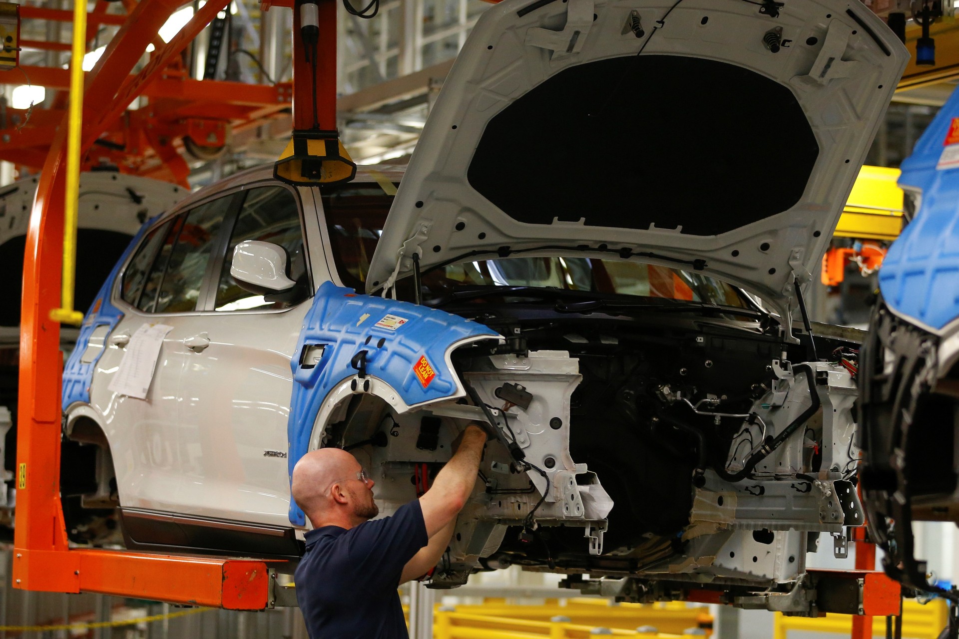 <p>A BMW employee works on the assembly of an X4 along the production line at the BMW manufacturing plant in Spartanburg, South Carolina.</p>