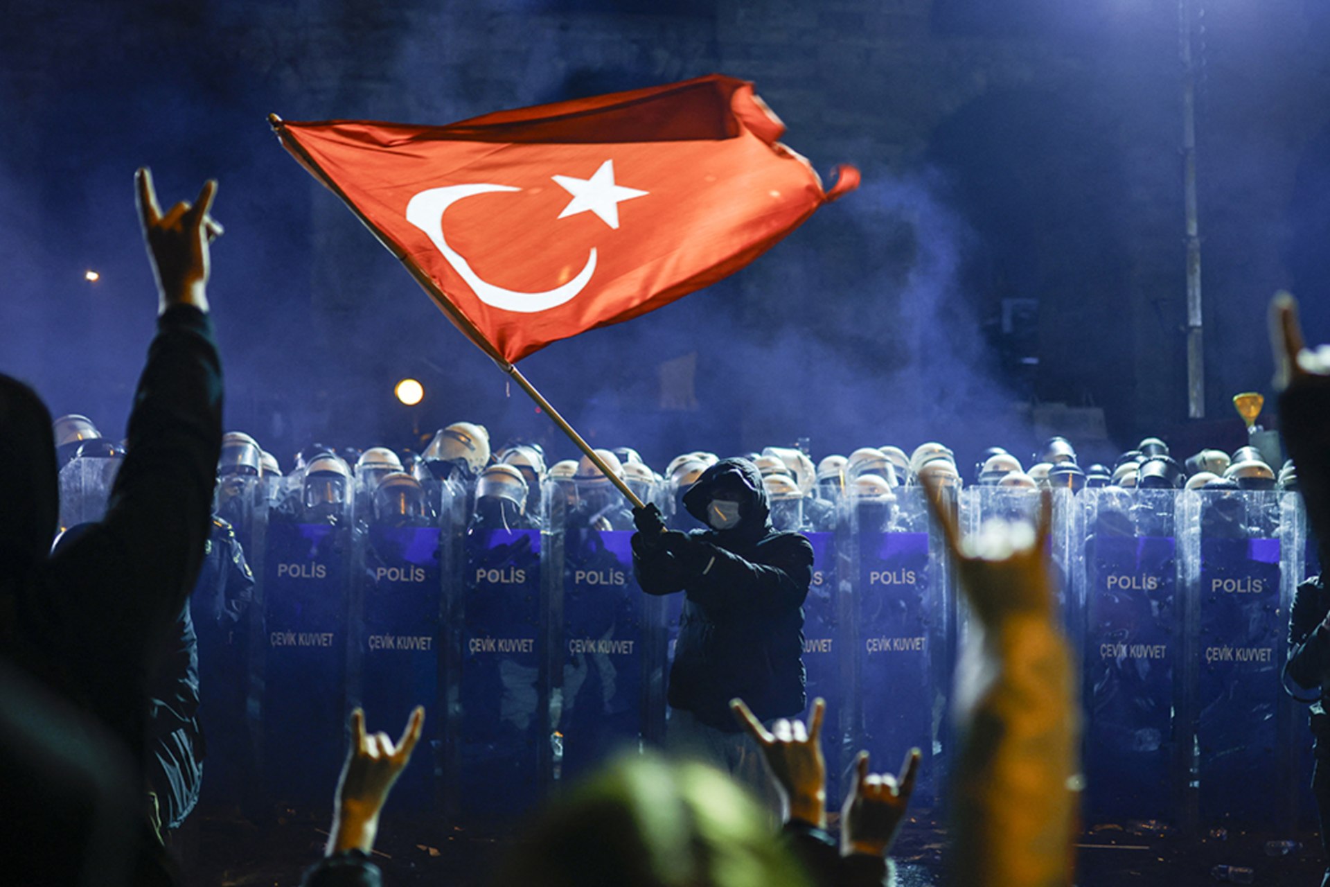 <p>A protester waves Turkey’s flag before riot police as protesters flash the grey-wolf salute during a demonstration outside the city hall to support mayor Ekrem İmamoğlu following his arrest in Istanbul, Turkey, March 22, 2025.</p>
