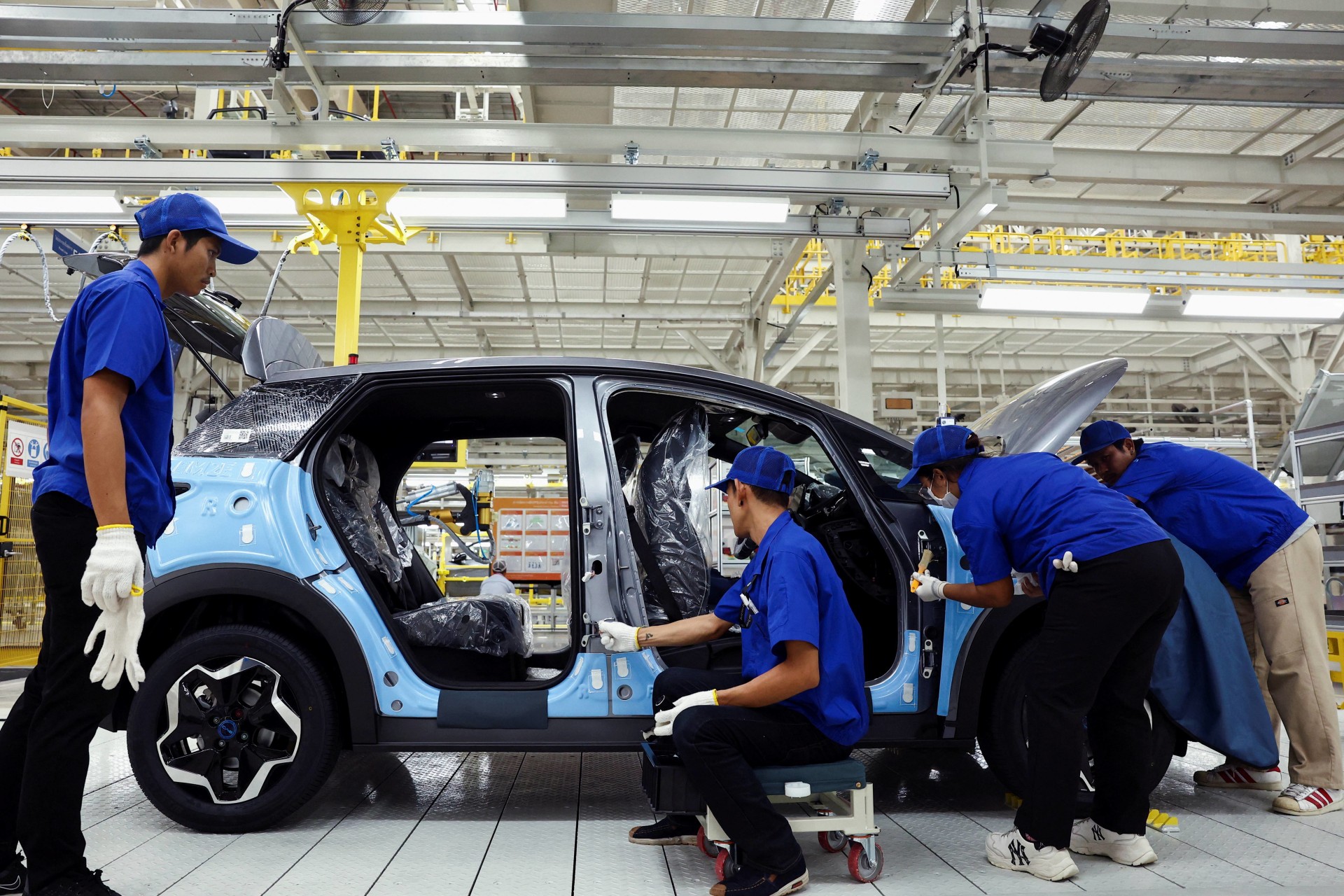 <p>Workers assemble an EV car inside BYD’s first electric vehicle (EV) factory in Southeast Asia, a fast-growing regional EV market where it has become the dominant player, in Rayong, Thailand, on July 4, 2024. </p>
