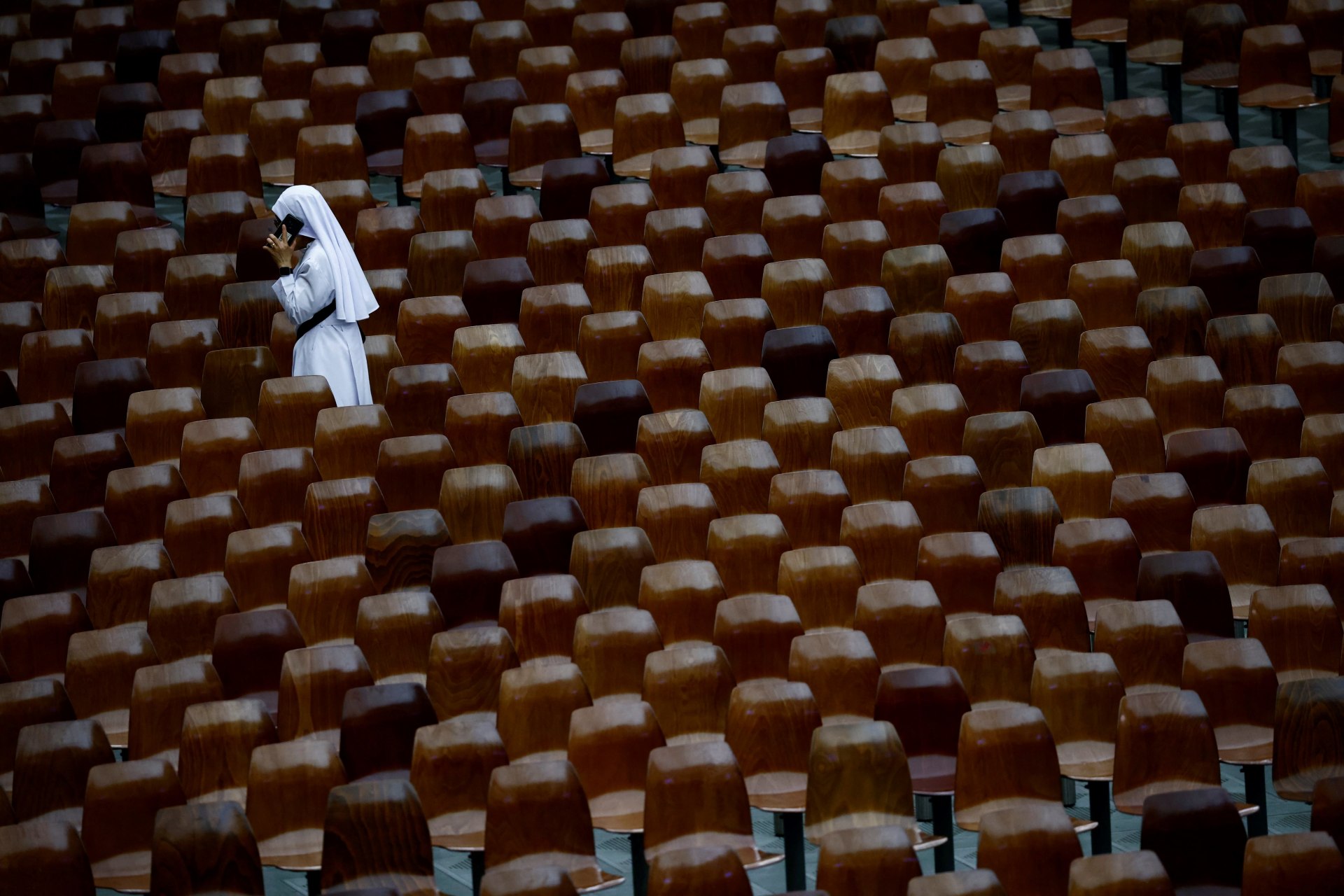 <p>A nun speaks on the phone before Pope Francis holds a special audience for the participants in the IV International Meeting of Choirs, in Paul VI Hall at the Vatican, June 8, 2024.</p>